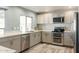 Updated kitchen with stainless steel appliances and granite countertops at 3910 W Michigan Ave, Glendale, AZ 85308