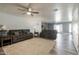 Cozy living room featuring two reclining sofas and wood-look floors at 3910 W Michigan Ave, Glendale, AZ 85308