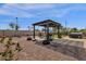 Backyard with pergola, hot tub, and grassy area at 42157 W Cribbage Rd, Maricopa, AZ 85138