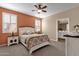 Cozy bedroom with ensuite bathroom and neutral color palette at 42157 W Cribbage Rd, Maricopa, AZ 85138