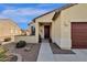 Front entrance with a covered porch and walkway, showcasing a welcoming atmosphere at 42157 W Cribbage Rd, Maricopa, AZ 85138