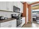 Kitchen features stainless steel appliances and white cabinetry at 42157 W Cribbage Rd, Maricopa, AZ 85138