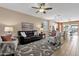 Open concept living room with a view into the kitchen and dining area at 42157 W Cribbage Rd, Maricopa, AZ 85138