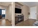 Living room featuring a fireplace and built-in entertainment center at 42157 W Cribbage Rd, Maricopa, AZ 85138