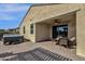 Patio with hot tub, seating area, and covered section at 42157 W Cribbage Rd, Maricopa, AZ 85138