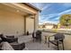 Relaxing covered patio with wicker furniture, perfect for outdoor enjoyment at 42157 W Cribbage Rd, Maricopa, AZ 85138