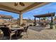 Patio with fire pit, seating area, and pergola at 42157 W Cribbage Rd, Maricopa, AZ 85138