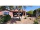 Backyard view of the covered patio and mature landscaping at 42621 W Heavenly Pl, Maricopa, AZ 85138