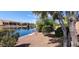Beautiful waterway view with mature landscaping and a charming bench at 42621 W Heavenly Pl, Maricopa, AZ 85138