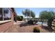 Scenic backyard with a view of the waterway and mature landscaping at 42621 W Heavenly Pl, Maricopa, AZ 85138