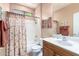 Bathroom with shower/tub combo and wood vanity at 42621 W Heavenly Pl, Maricopa, AZ 85138