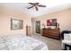 Spacious bedroom with king bed and large dresser at 42621 W Heavenly Pl, Maricopa, AZ 85138