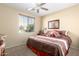 Bedroom with king-size bed and ceiling fan at 42621 W Heavenly Pl, Maricopa, AZ 85138