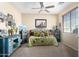 Cozy bedroom with a daybed and decorative accents at 42621 W Heavenly Pl, Maricopa, AZ 85138