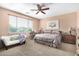 Spacious bedroom with a king-size bed and an ensuite bathroom at 42621 W Heavenly Pl, Maricopa, AZ 85138