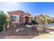 One-story home with desert landscaping and a two-car garage at 42621 W Heavenly Pl, Maricopa, AZ 85138