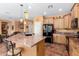 Kitchen boasts granite countertops and ample cabinetry at 42621 W Heavenly Pl, Maricopa, AZ 85138