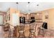 Open kitchen with large island and breakfast bar at 42621 W Heavenly Pl, Maricopa, AZ 85138