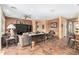 Spacious living room featuring comfortable seating and a large TV at 42621 W Heavenly Pl, Maricopa, AZ 85138