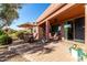 Spacious patio with seating area, umbrella, and lake view at 42621 W Heavenly Pl, Maricopa, AZ 85138