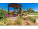 Relaxing outdoor pergola with seating, perfect for enjoying the community at 42621 W Heavenly Pl, Maricopa, AZ 85138