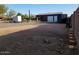 The backyard features a large gravel area perfect for parking or storage, with a storage shed at 44311 N 1St Dr, New River, AZ 85087