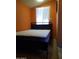 Bedroom with orange walls featuring a queen bed and tile floor at 44311 N 1St Dr, New River, AZ 85087