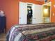 Bright bedroom with open closet doors, vibrant walls and a visible window at 44311 N 1St Dr, New River, AZ 85087