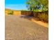 Gravel driveway with a gated entrance and a mountain view at 44311 N 1St Dr, New River, AZ 85087