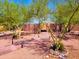 A front gate that adds curb appeal through stone accents and lush foliage at 44311 N 1St Dr, New River, AZ 85087