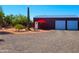 Detached garage with double doors and a patio area with seating at 44311 N 1St Dr, New River, AZ 85087