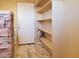 Laundry room with white shelving, marble tile floor, and washer and dryer hookups at 44311 N 1St Dr, New River, AZ 85087