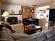 Spacious living room featuring a cozy fireplace and eat-in-kitchen at 44311 N 1St Dr, New River, AZ 85087