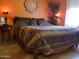 Bedroom featuring lamps, tiled floors, and decorative items at 44311 N 1St Dr, New River, AZ 85087