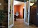 The office features decorative double doors and an orange accent wall at 44311 N 1St Dr, New River, AZ 85087