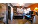 Home office features wood-paneled accent wall and built-in desk at 44311 N 1St Dr, New River, AZ 85087