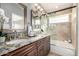 Elegant bathroom with double sinks and glass shower at 4849 E Abraham Ln, Phoenix, AZ 85054