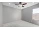 Bedroom with ceiling fan and window at 4849 E Abraham Ln, Phoenix, AZ 85054