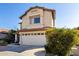 Two-story house with a two-car garage and desert landscaping at 4849 E Abraham Ln, Phoenix, AZ 85054