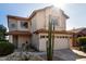 Two-story house with a two-car garage and desert landscaping at 4849 E Abraham Ln, Phoenix, AZ 85054