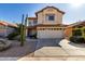 Two-story house with a two-car garage and desert landscaping at 4849 E Abraham Ln, Phoenix, AZ 85054