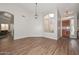 Open-concept living room with wood laminate flooring at 5184 W Del Rio St, Chandler, AZ 85226