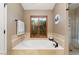 Spa-like bathroom with garden tub, tile shower, and wood shutters at 5213 W Soft Wind Dr, Glendale, AZ 85310