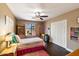 Bright bedroom with double closet and wood flooring at 5213 W Soft Wind Dr, Glendale, AZ 85310