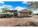 Detached garage with covered boat storage and additional workshop space at 5213 W Soft Wind Dr, Glendale, AZ 85310