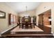 Elegant dining room with hardwood floors and a large wooden buffet at 5213 W Soft Wind Dr, Glendale, AZ 85310