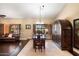 Spacious dining area with hardwood floors and a large table at 5213 W Soft Wind Dr, Glendale, AZ 85310