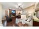 Living room with hardwood floors, stone fireplace and large windows at 5213 W Soft Wind Dr, Glendale, AZ 85310