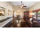 Bright living room with hardwood floors and a wooden cabinet at 5213 W Soft Wind Dr, Glendale, AZ 85310