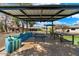 Outdoor patio with covered seating and ping pong table at 5213 W Soft Wind Dr, Glendale, AZ 85310